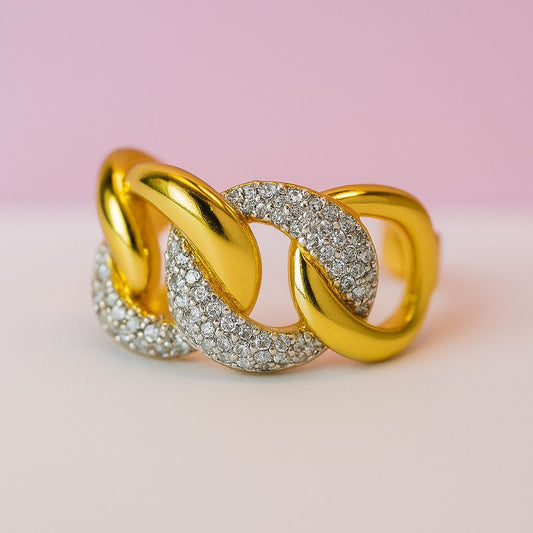 Anillo eslabones color dorado con zirconias