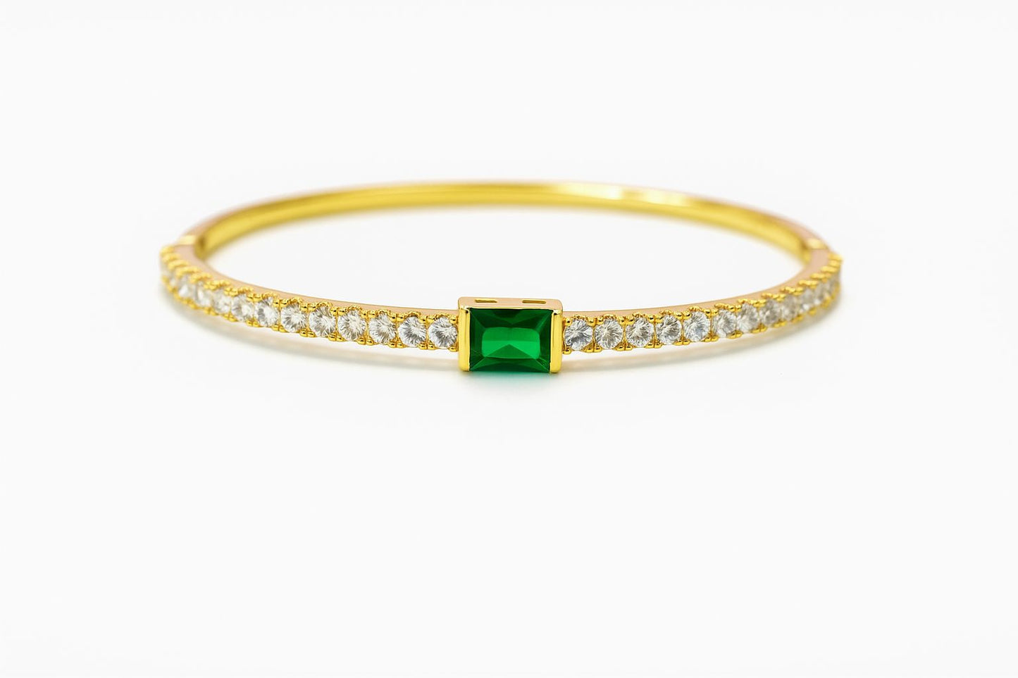 Pulsera dorada con zirconias y piedra verde
