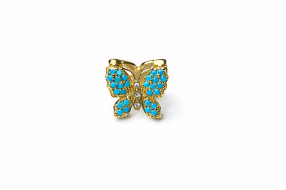 Mariposa azul turquesa  con dorado